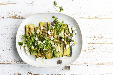 Grilled courgette with feta and garden herbs