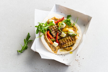 Veggie pizza wrap baba ganoush, tricolore peppers and feta