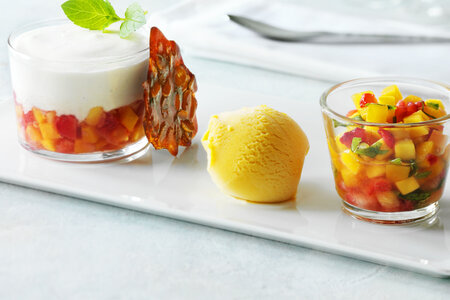 Fruit Brunoise in jelly of Moscato d'Asti with panna cotta and mango sorbet