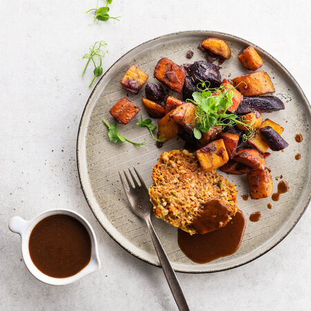 Vegan meat loaf and gravy with chunky sautéed carrots 